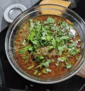 Delicious homemade Mutton Masala Curry served in a bowl, garnished with fresh coriander leaves